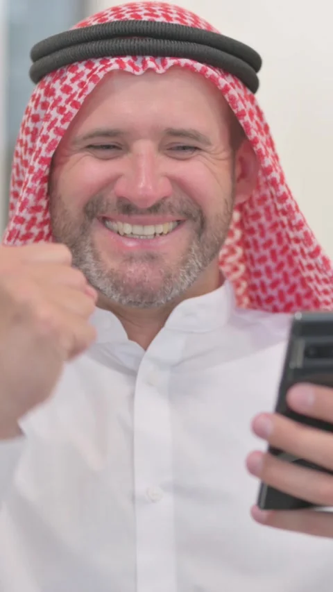 Portrait of Arab Man Using Phone, vertical video Stock Footage 324711377