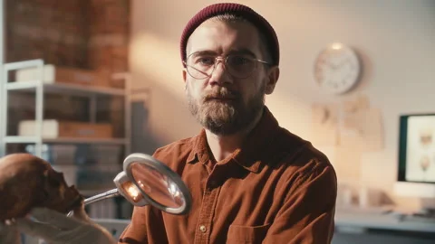 Portrait of Archaeologist Examining Skull during Research in Laboratory Stock Footage 296516049