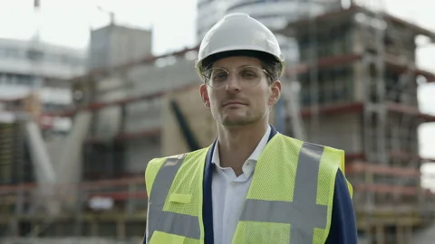 Portrait of architect in helmet posing on construction plan Stock Footage 167226603