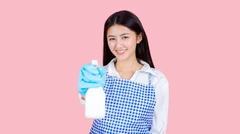 Portrait asian beautiful woman wearing apron and rubber gloves for cleaning , Stock Photos