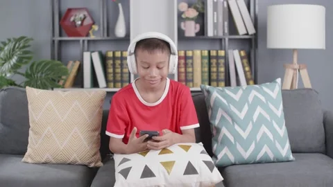 Portrait of asian boy using laptop while studying at home Stock Footage 157946818