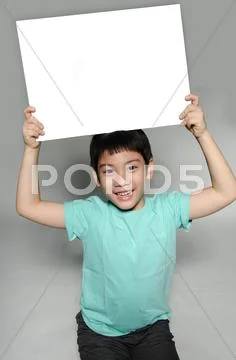 Portrait of asian child with blank plate for add your text . Stock Photos