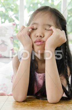 Portrait of asian child in a depressed mood . Stock Photos