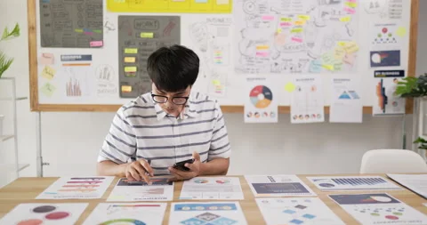 Portrait of Asian man glasses checking to task on workplace desk while sitting Stock Footage 201920518
