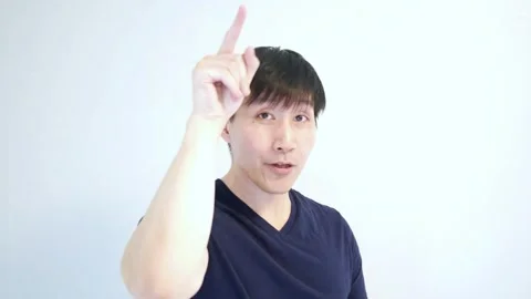 Portrait of Asian man pointing to the camera and saying you Stock Footage 248869137