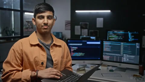 Portrait of Asian Software Developer Holding Laptop in Tech Office Stock Footage 348375984