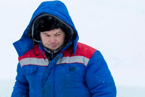 Portrait of an assembler in a blue jacket 스톡 사진