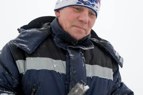 Portrait of an assembler in a blue jacket 스톡 사진