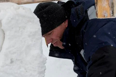 Portrait of an assembler in a blue jacket Fotos Stock