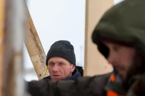 Portrait of an assembler in a blue jacket Fotos Stock