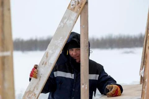 Portrait of an assembler in a blue jacket 스톡 사진