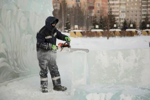 Portrait of an assembler with a chainsaw in his hands Foto stock