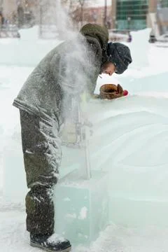 Portrait of an assembler with a chainsaw in his hands 写真素材