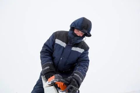 Portrait of an assembler with a chainsaw in his hands Fotos Stock