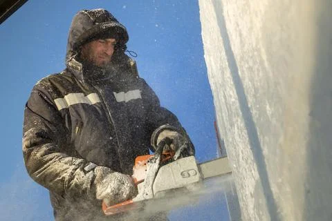Portrait of an assembler with a chainsaw in his hands Fotos Stock