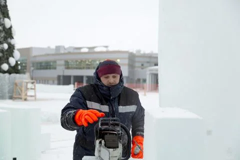 Portrait of an assembler with a chainsaw in his hands Fotos Stock