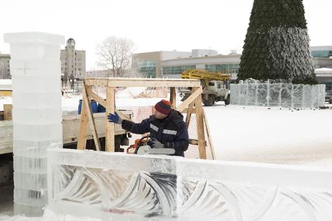 Portrait of an assembler with a chainsaw in his hands 스톡 사진