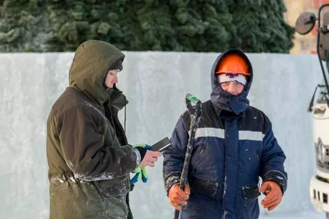 Portrait of an assembler in an orange helmet 写真素材
