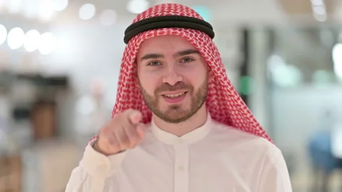 Portrait of Assertive Arab Businessman with Pointing at the Camera Stock Footage 139411141