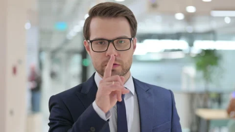 Portrait of Assertive Businessman with Finger on Lips, Quiet Sign Stock Footage 140361144