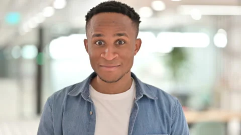 Portrait of Assertive Casual African Man Pointing and Inviting Stock Footage 139252677
