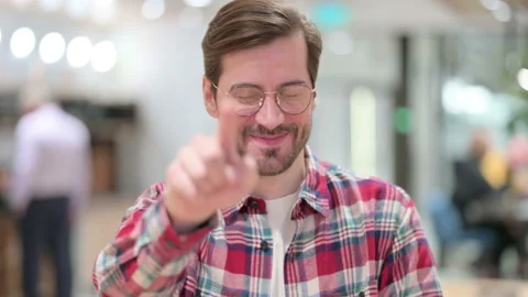 Portrait of Assertive Male Designer Pointing at the Camera Stock Footage 139692552