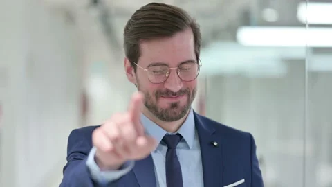 Portrait of Assertive Young Businessman with Pointing at the Camera Video stock 139690003