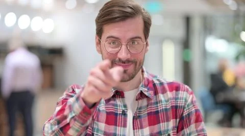 Portrait of Assertive Young Man Pointing at the Camera Stock Photos