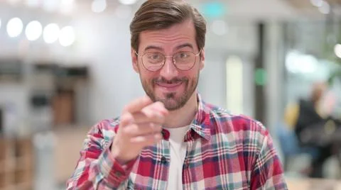 Portrait of Assertive Young Man Pointing with Finger Stock Photos
