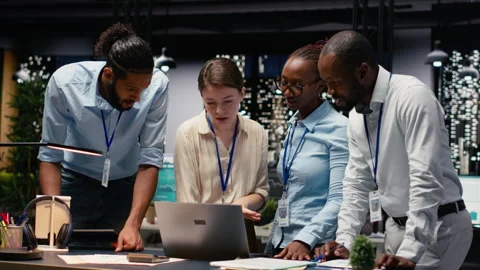 Portrait of associates team collaborating in office environment at night Stock Footage 334044520