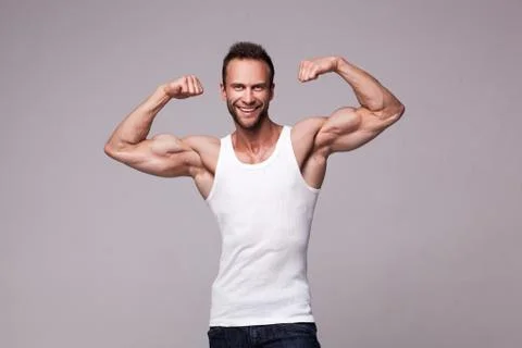 Portrait of athletic man in white undershirt Stock Photos