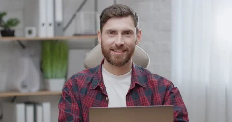 Portrait of Attractive Bearded Programmer sitting Working Remote from Home Stock Footage 151025221