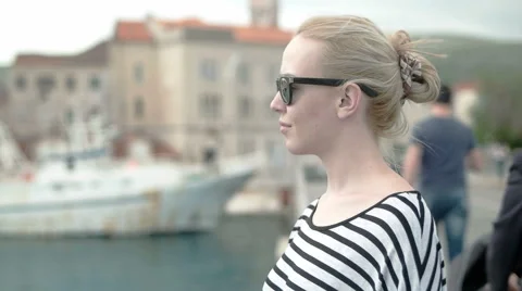 Portrait of attractive blond smiling at the camera Stock Footage 50987963