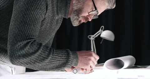 Portrait of Attractive Engineer making Drawings and Blueprints at his Office Vídeo Stock 145436183