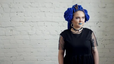 Portrait of attractive girl with blue dreadlocks Stock Footage
