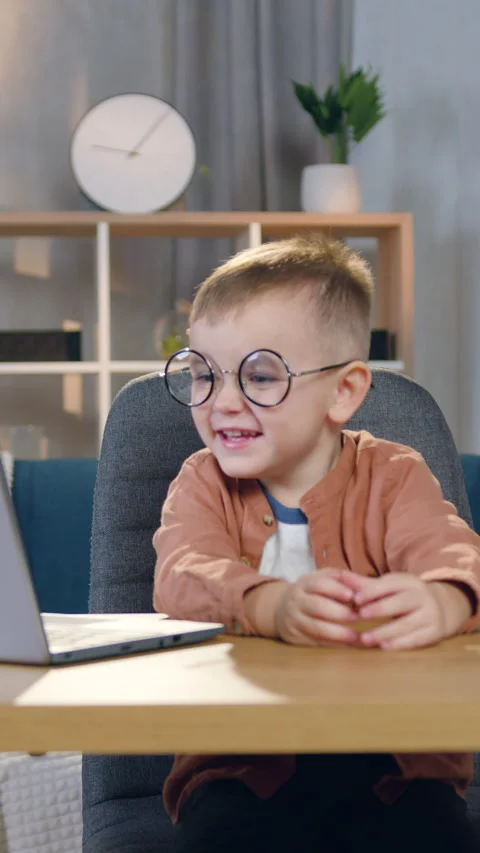 Portrait of attractive joyful amusing 2-aged child in stylish eyeglasses which p Stock Footage 328843581