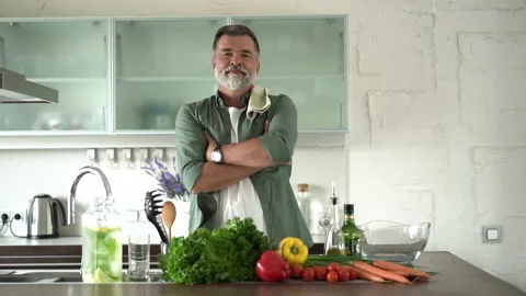 Portrait of attractive man looking camera at domestic kitchen, smiling Stock Footage 189790881