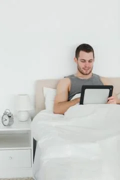 Portrait of an attractive man using a tablet computer Stock Photos