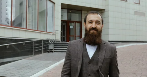 Portrait of attractive stylish young man looking into the camera and smiling Stock-Footage 91256853