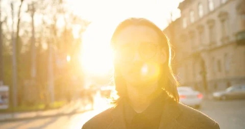 Portrait of attractive young man with beard and mustache in glasses and jacket Stock Footage 123770443