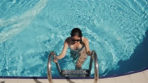 Portrait of Attractive Young Woman Going Out From Swimming Pool Outdoors. Stock Footage