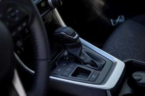 A portrait of an automatic gear shift stick in a hybrid car, meaning it dri.. Stock Photos