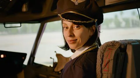 Portrait of aviation copilot using control panel command in cockpit Foto stock