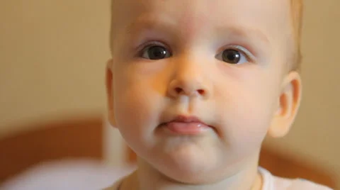 Portrait of a baby looking at the camera Stock Footage 49602578