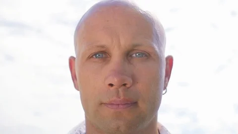 Portrait of a bald man looking directly at the camera. Close up shot. Stock Footage 115132969
