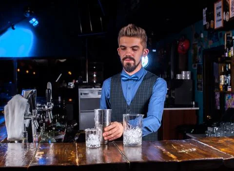 Portrait of bartender makes a show creating a cocktail in cocktail bars Stock Photos
