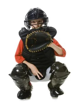 Portrait of a baseball catcher crouching Stock Photos