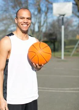 Portrait of a basketball player on an outdoor basketball court Stock Photos