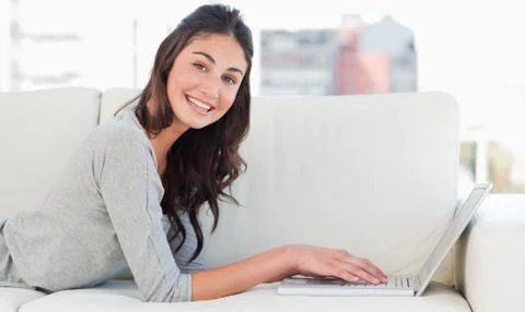 Portrait of a beaming student using a mac Stock Photos