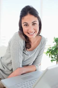 Portrait of a beaming student using a personal computer Stock Photos